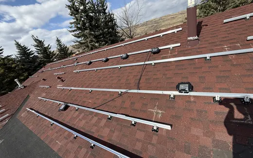 Racking layout on a red shingle roof