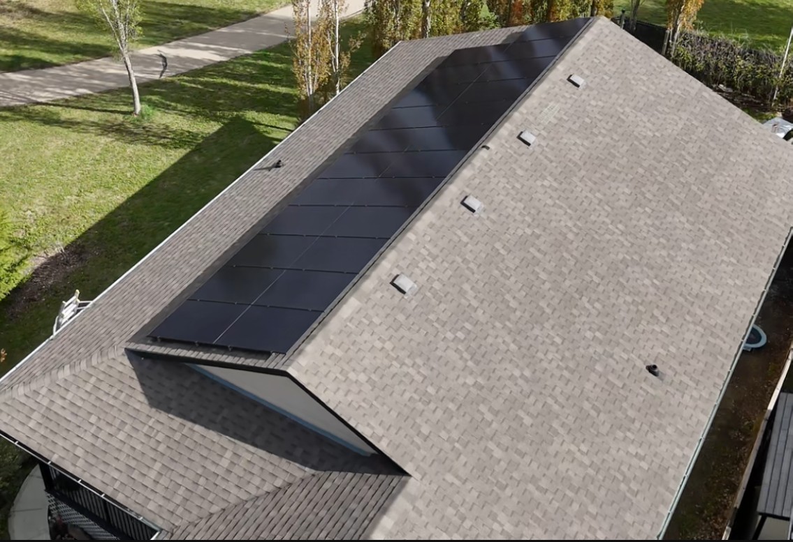 Aerial view of solar panels across a complex roof line